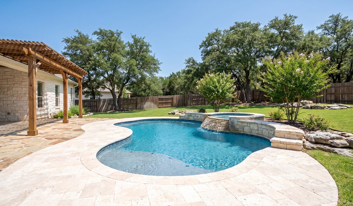 Newly built custom gunite pool with a travertine deck at a Texas home