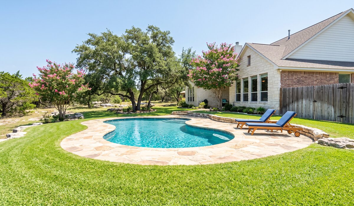 Sparkling backyard swimming pool at a Texas home on a sunny day