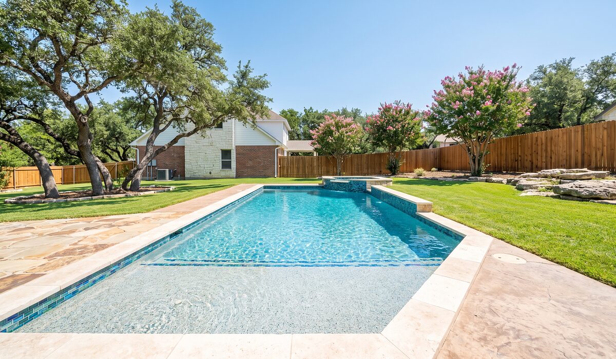 Remodeled swimming pool with new tile and coping at a Texas home