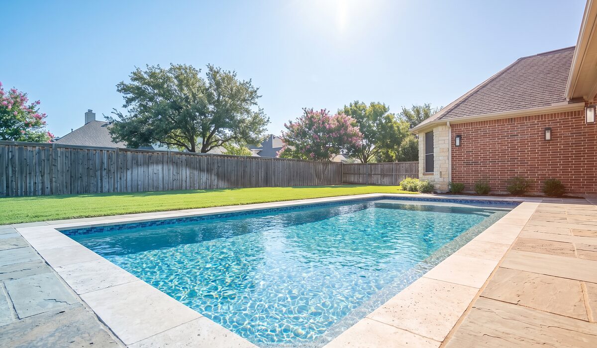 Remodeled swimming pool with new tile and coping at a Texas home