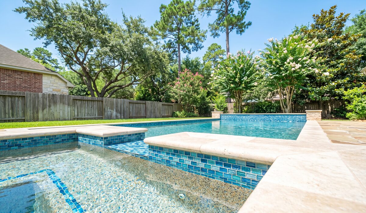 Remodeled swimming pool with new tile and coping at a Texas home