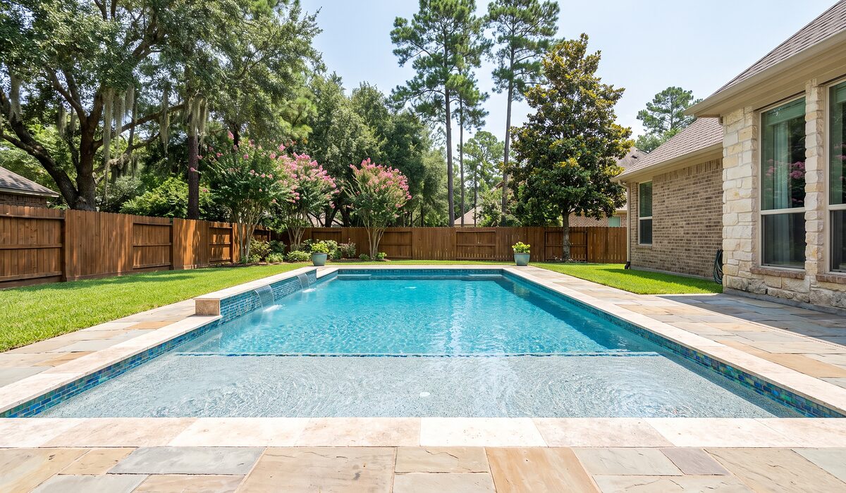 Remodeled swimming pool with new tile and coping at a Texas home