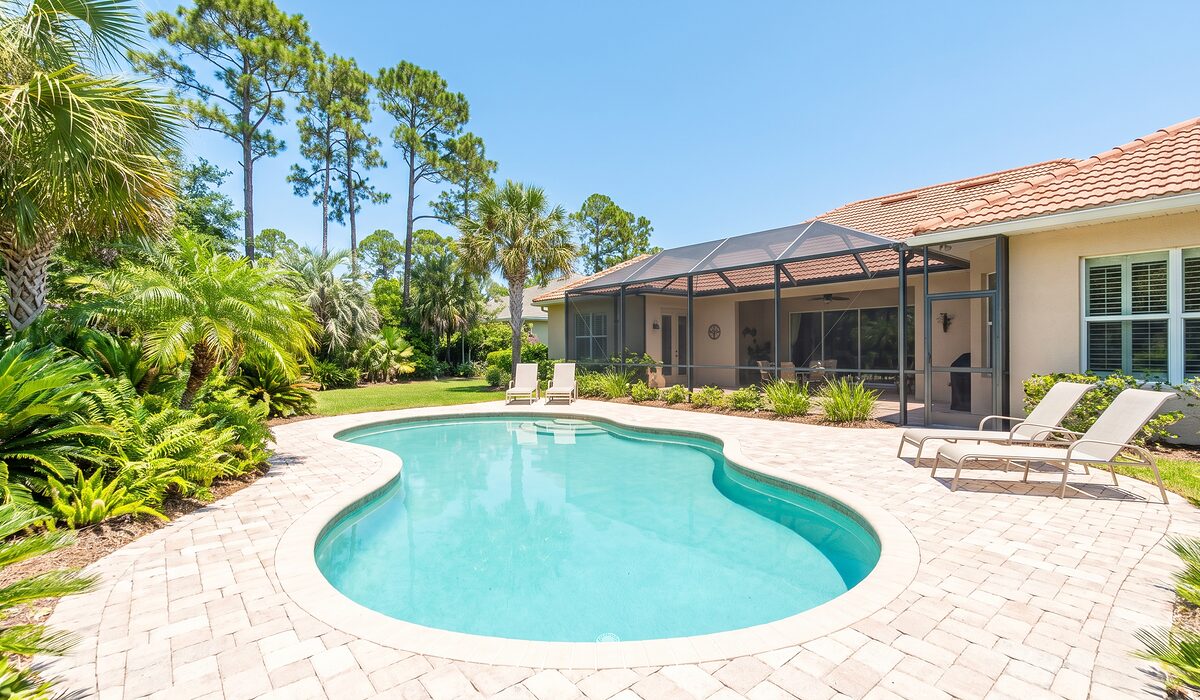 Sparkling backyard swimming pool on a sunny day