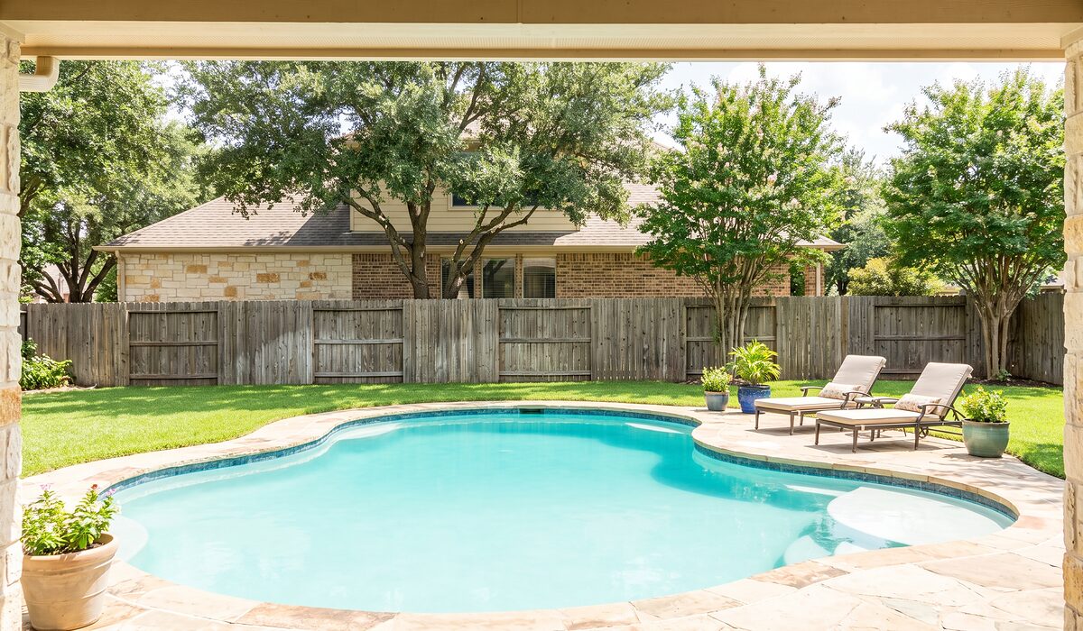 Sparkling backyard swimming pool at a Texas home on a sunny day