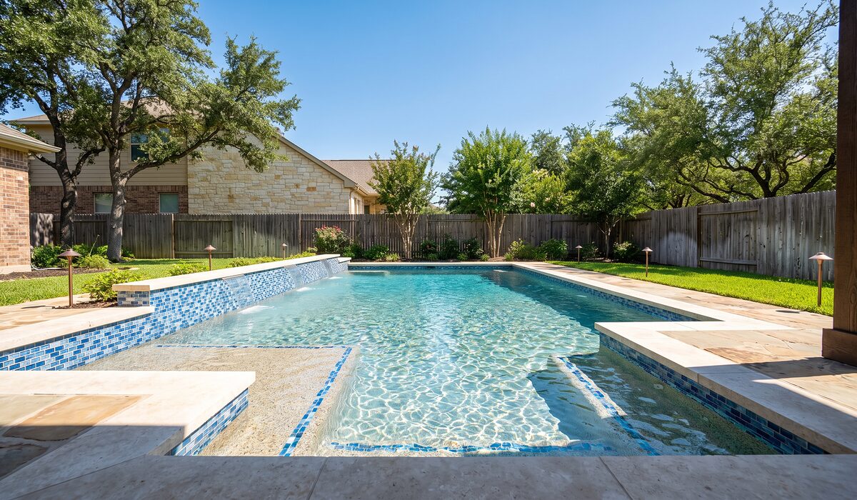 Remodeled swimming pool with new tile and coping at a Texas home