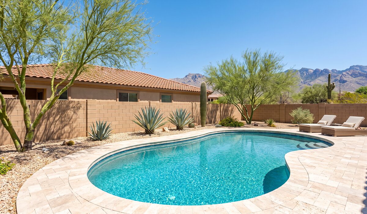 Sparkling backyard swimming pool with desert landscaping at an Arizona home